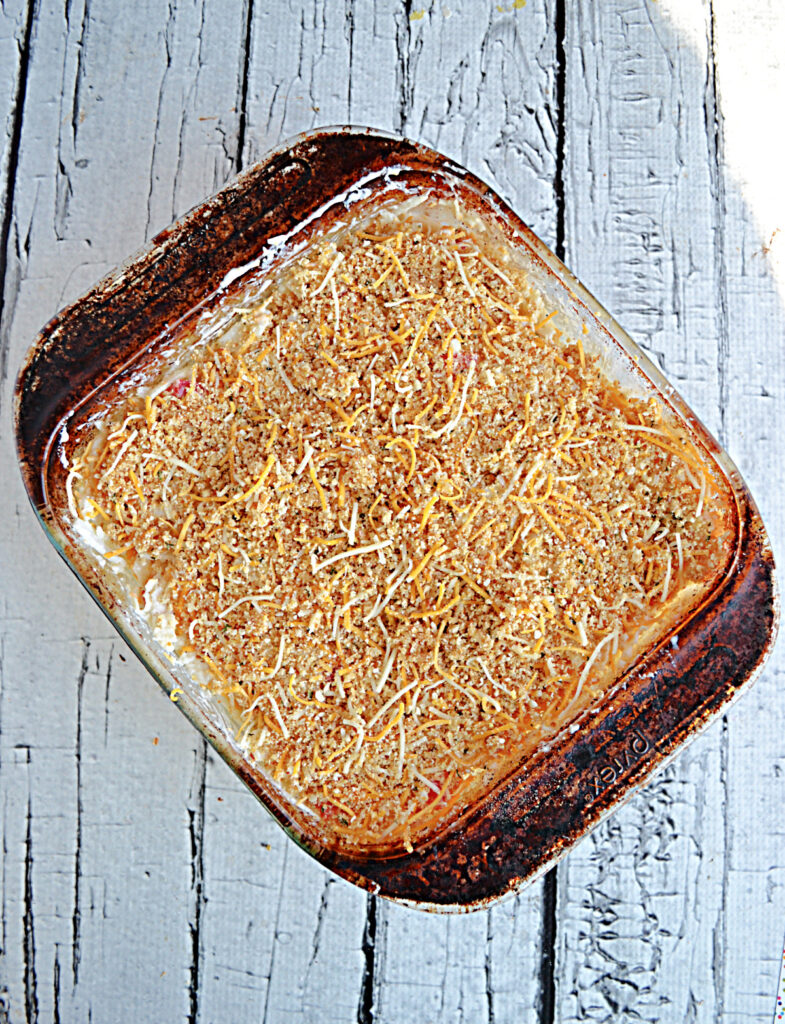 A baking dish of hash browns topped with bread crumbs. 
