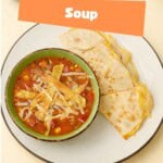 Pin Image: Title, a bowl of soup and a quesadilla.