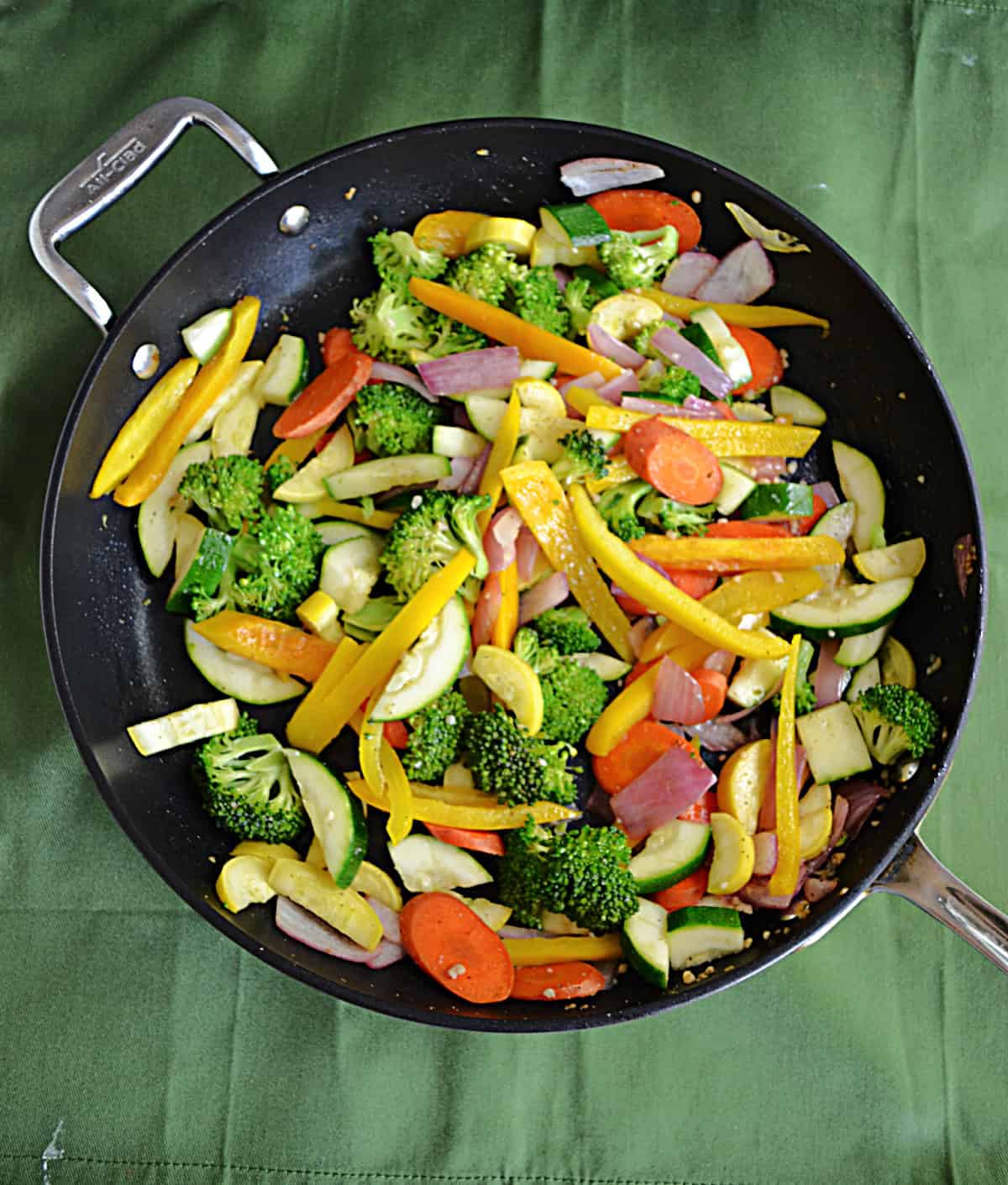 A skillet full of colorful vegetables.