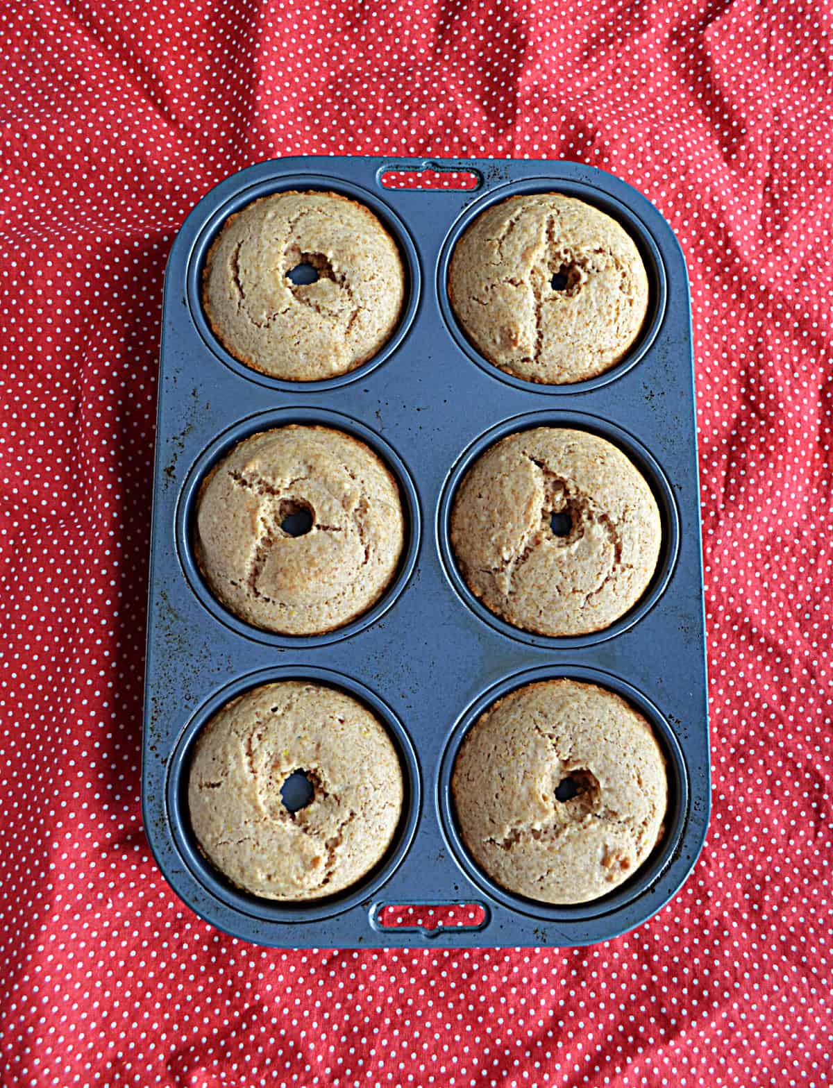 A donut pan with donuts in it.