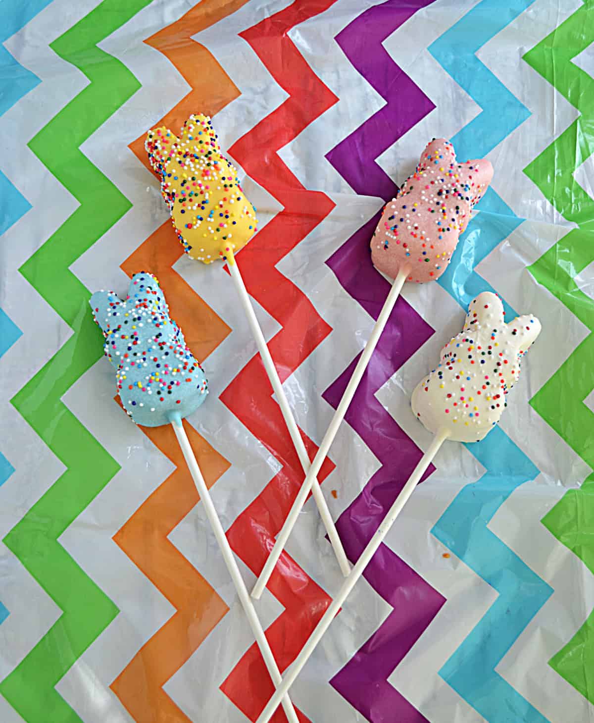 Pastel Chocolate covered Peeps on sticks.