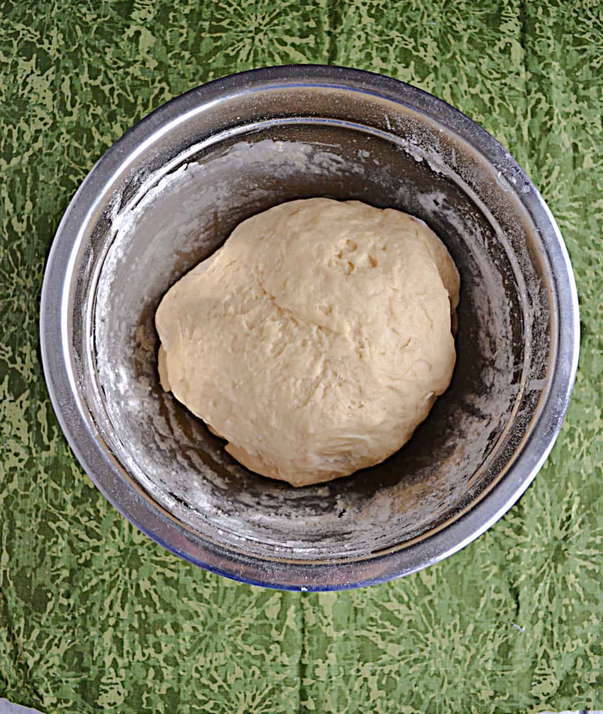 A bowl with dough in it.