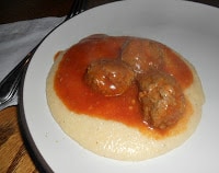 Greek meatballs served on Polenta