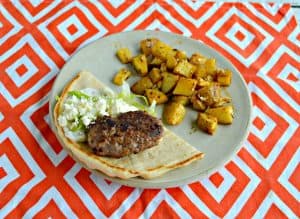 Lamb burger in a pita with a side of Greek potatoes