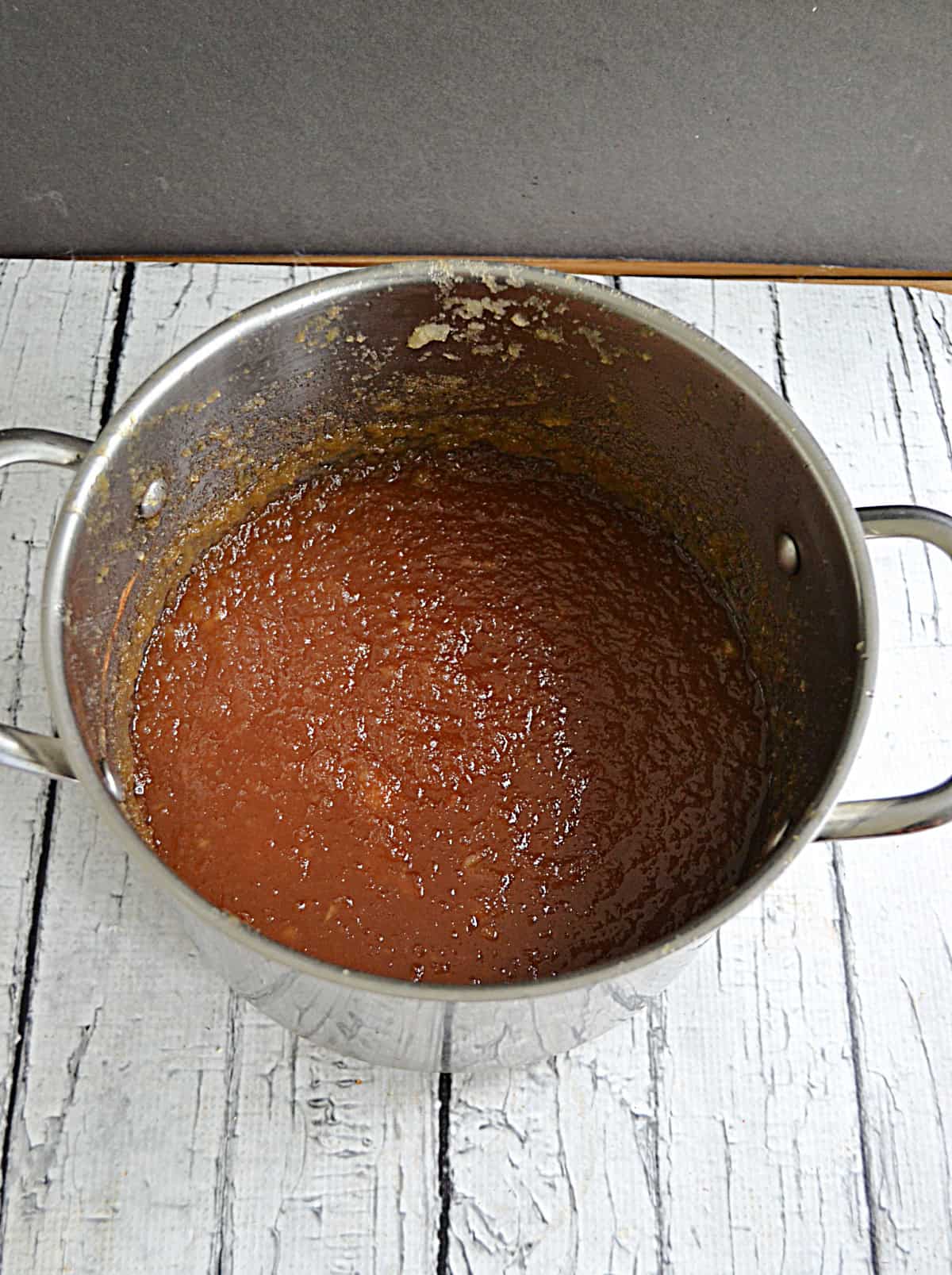 A pot with apple butter in it.