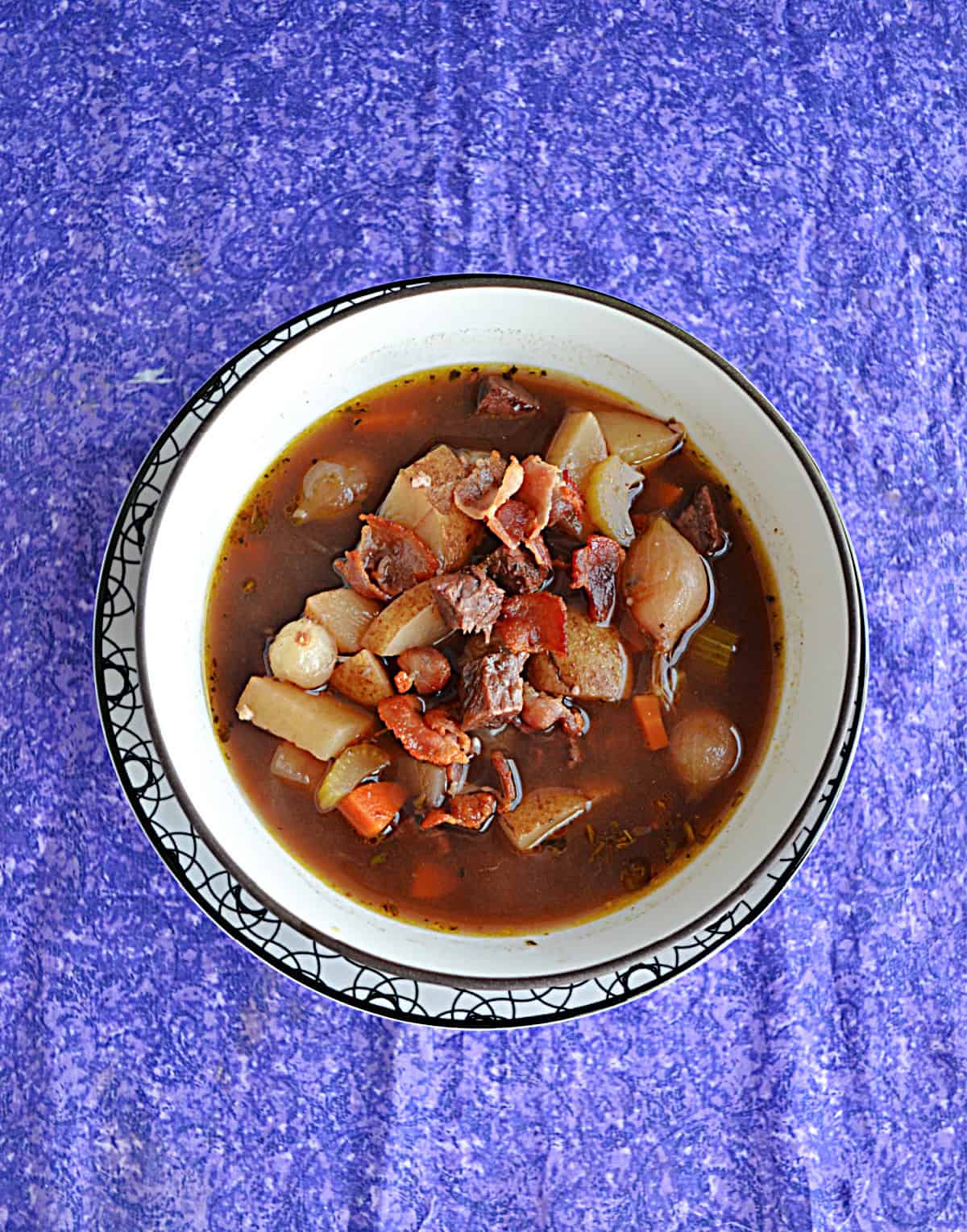 A bowl of beef Burgundy soup.