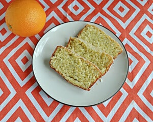 A close up view of a plate of slices of orange bread.