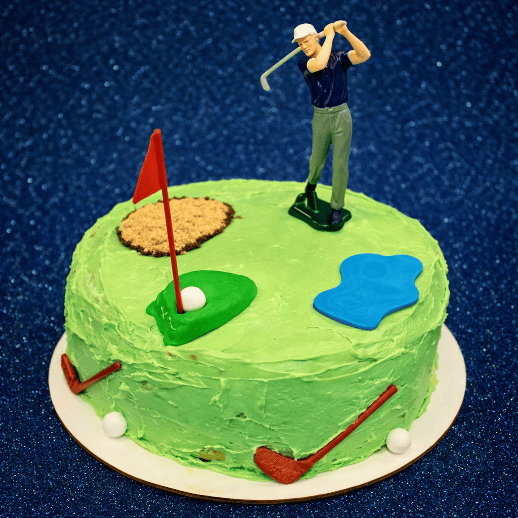 A cake decorated like a golf course.