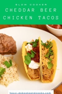 Pin Image: Title, A plate with two tacos, a scoop of rice, a scoop of beans, and a bowl of salsa in the background.