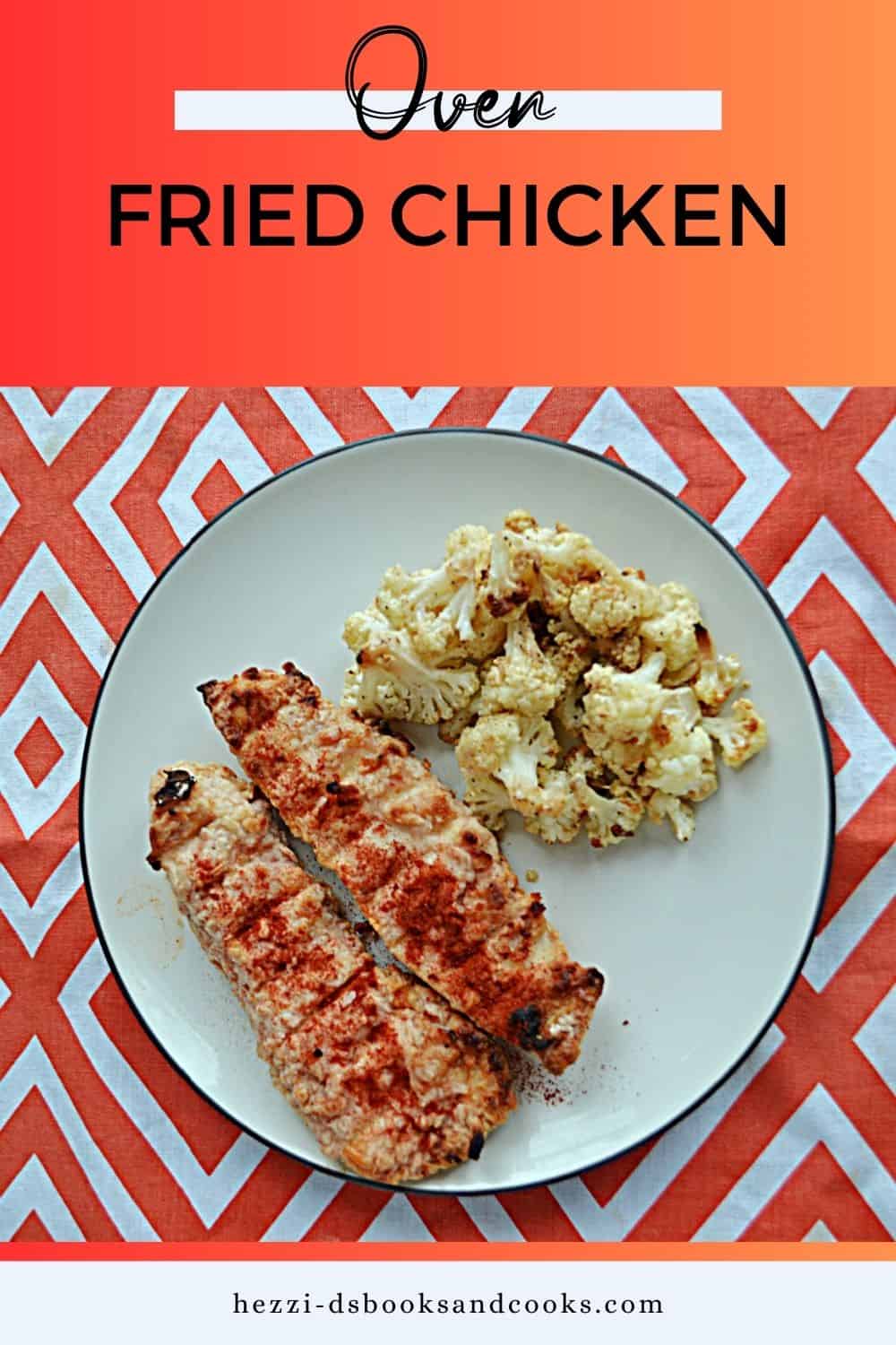 Pin Image:   Text title, a plate with two pieces of oven fried chicken and cauliflower on it. 