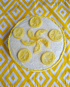 A Top view of a Lemonade Cake with candied lemons on top.