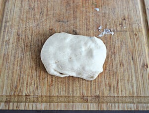 A crescent roll packet stuffed and rolled.