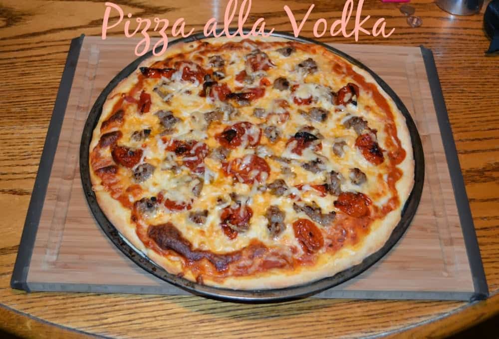 Pizza alla Vodka with homemade Vodka sauce, Italian sausage, and roasted tomatoes