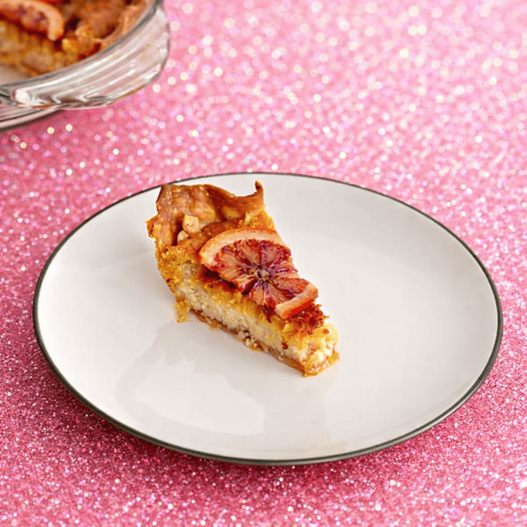 A top view of a slice of blood orange pie.