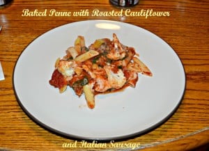 Baked Penne is layered with roasted cauliflower, Italian sausage, spinach, sauce, and cheeses.