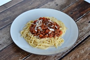 Bolognese Sauce is made with red wine, ground beef, and fresh vegetables. https://www.hezzi-dsbooksandcooks.com
