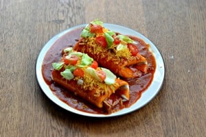 Wet Burritos stuffed with chicken and topped with homemade sauce.