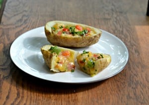 Omelet stuffed breakfast potatoes: Potato skins stuffed with eggs, cheese, peppers, bacon, and potatoes.