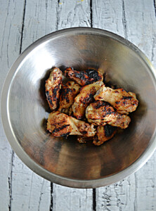 A bowl of crispy grilled wings.