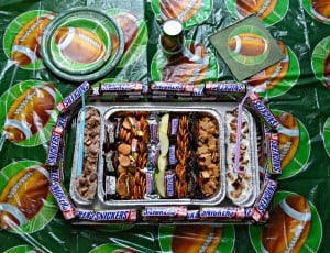 SNICKERS snack stadium with 2 SNICKERS dips, mini candy bars, and other fun dippers!