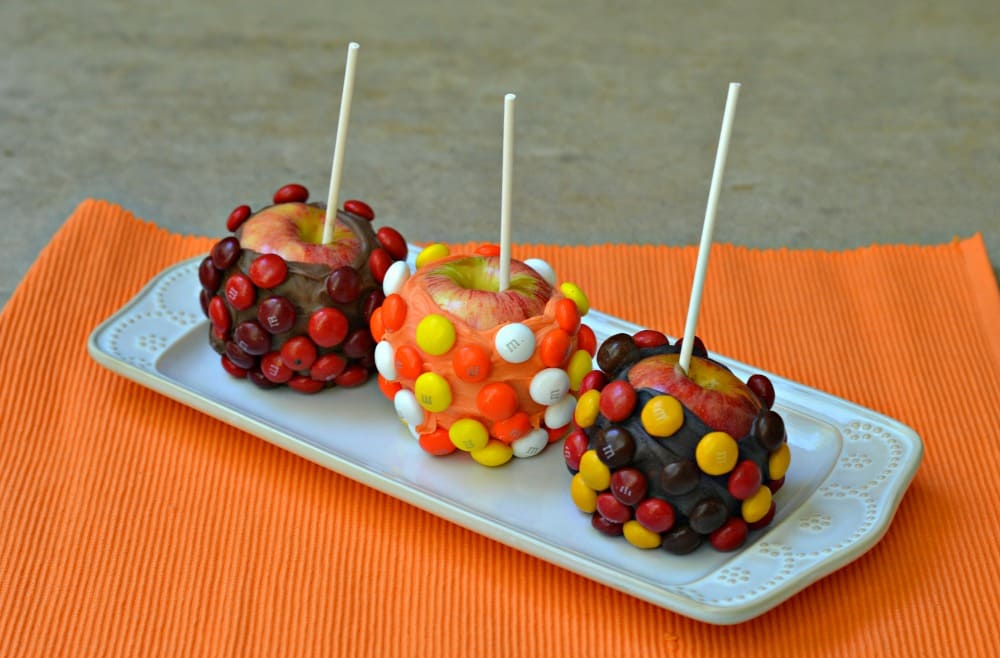 Chocolate dipped apples covered in Candy Corn M&M's, Candy Apple M&M's, and Peanut BUtter M&M's.