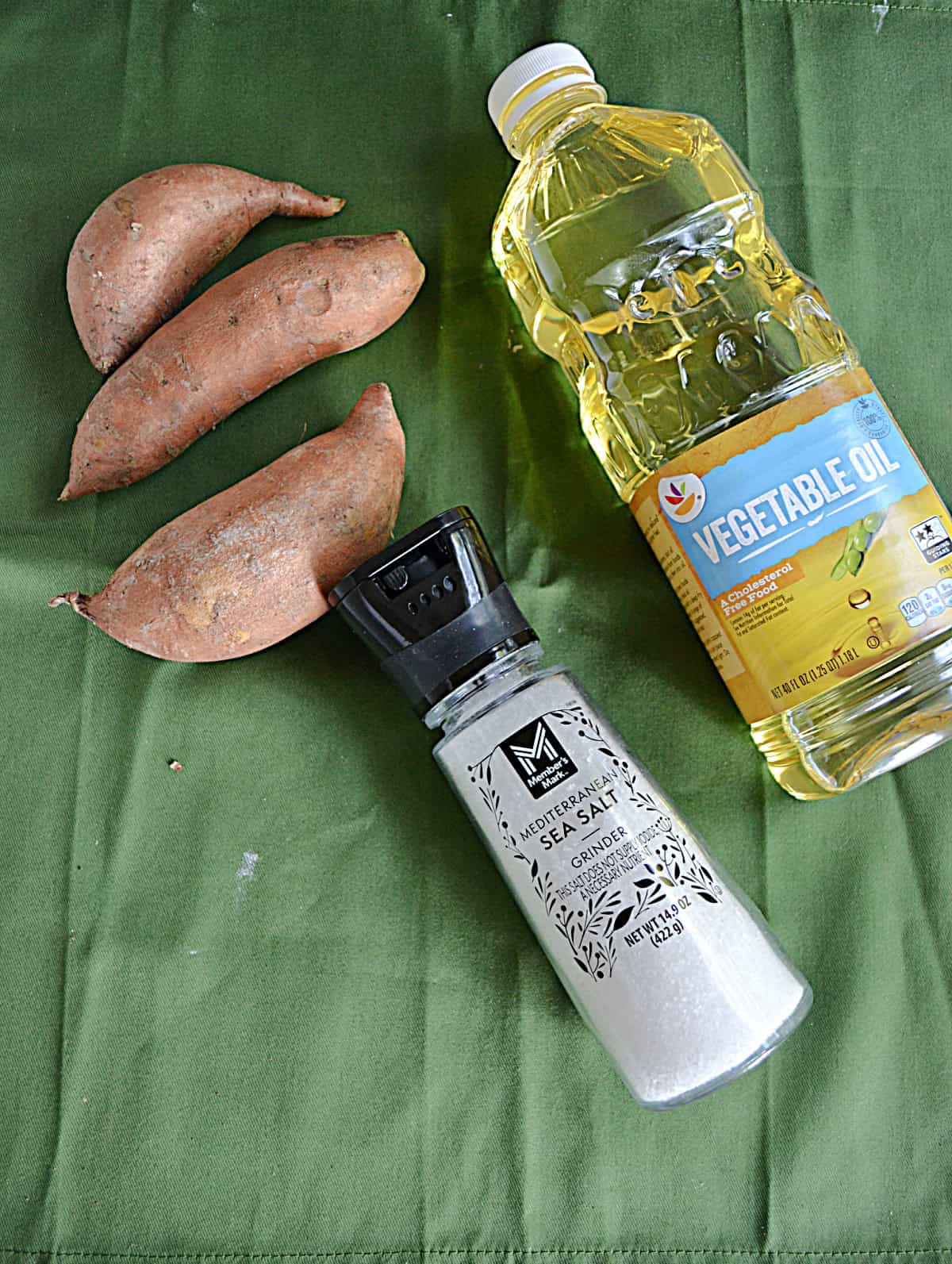 Sweet potatoes, a bottle of vegetable oil, and salt.