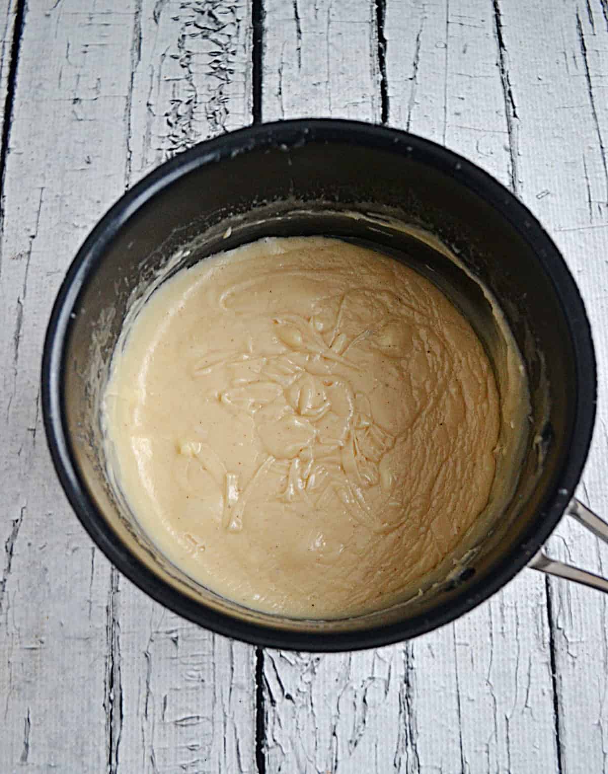 A pot with melted fudge in it.