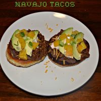 Navajo Tacos with ground beef, cheese, and vegetables on crispy bread