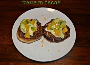 Navajo Tacos with ground beef, cheese, and vegetables on crispy bread