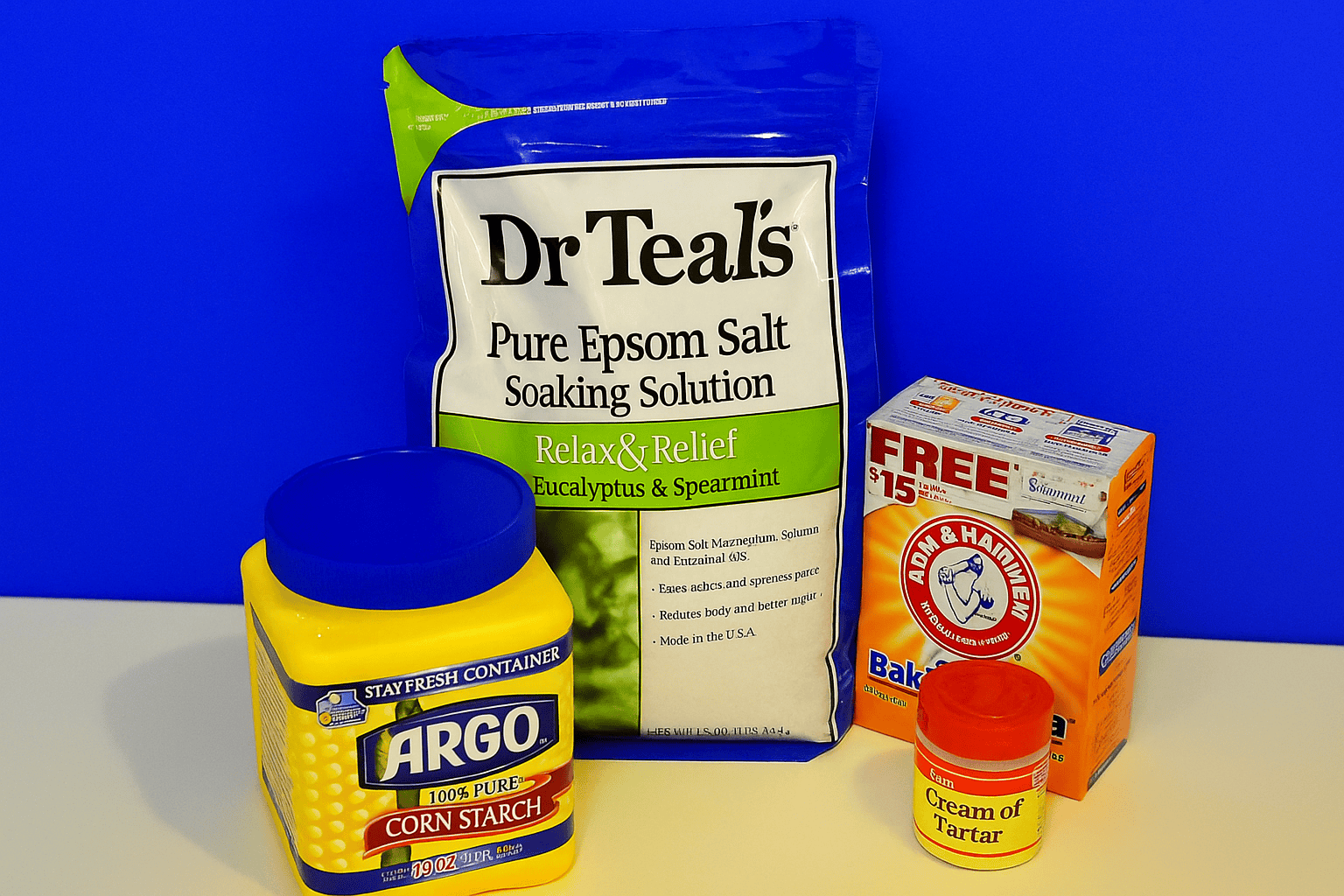 A bag of bath salts, a container of cornstarch, and baking soda.