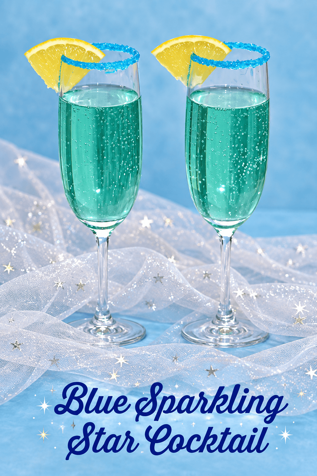 Pin Image: Title, two champagne glasses with a blue cocktail in them and an orange wedge on the rim.