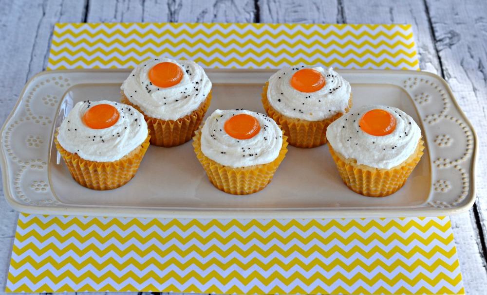 Bacon and "Eggs" Cupcakes are a fun way to fool the kids on April Fool's Day!   Delicious sweet and savory bacon cupcakes frosted to look like eggs.