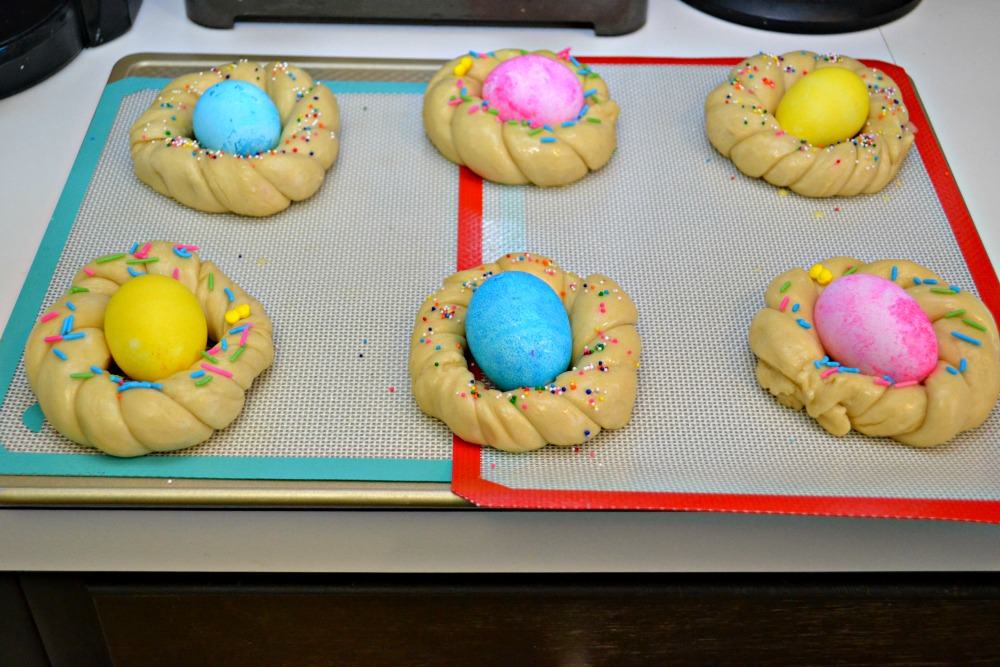 Individual Easter Egg Bread with dyed Easter eggs in the middle