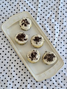 OREO cookie cupcakes topped with vanilla frosting and sprinkled with Oreos.