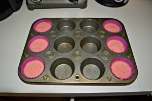 Bright Pink Strawberry Cupcakes topped with Lemoande Frosting