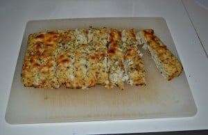 Tasty Cauliflower Breadsticks are topped off with herbs and cheese