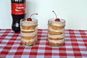 Coke Float Cupcakes in a Jar layers Coke Cupcakes with Cherry Vanilla Frosting and puts a cherry on top