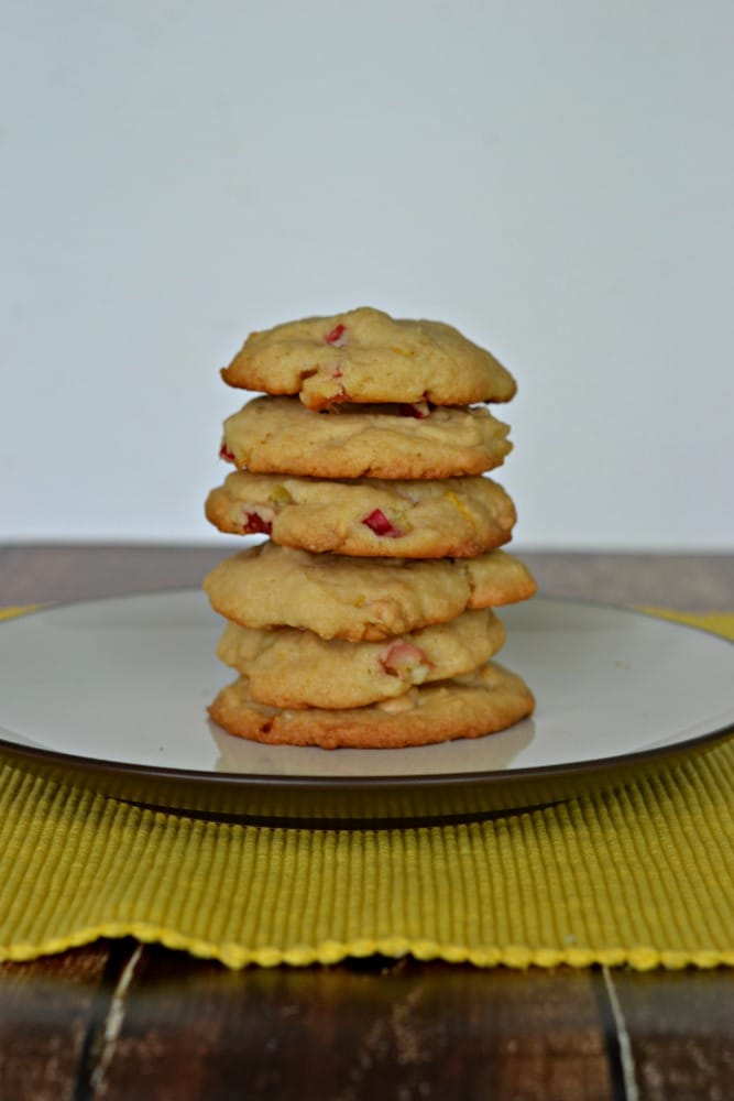 A plate with a stack of lemon rhubarb cookies piled on top. 