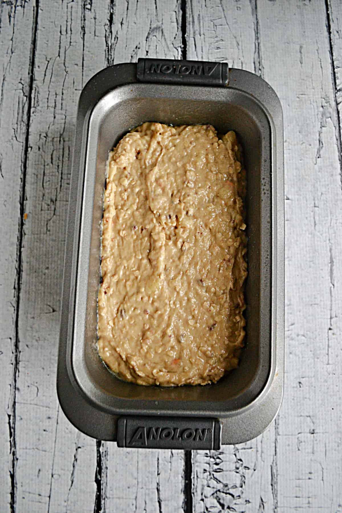 A pan with banana bread batter in it.