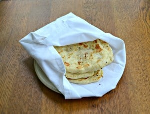 Homemade Naan is a flatbread made in a skillet and brushed with garlic and butter