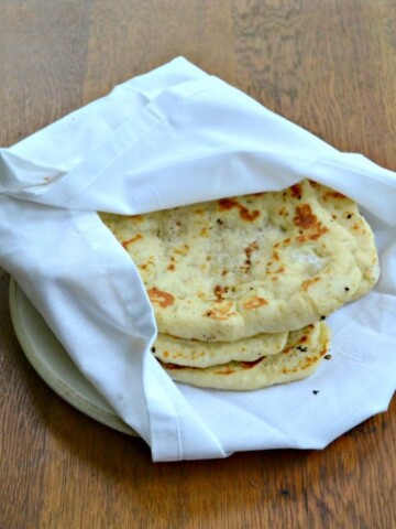 Homemade Naan is a flatbread made in a skillet and brushed with garlic and butter