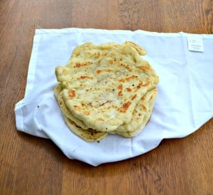 Naan is a delicious flatbread that can be eaten alone, used for pizza, or used for a wrap/sandwich