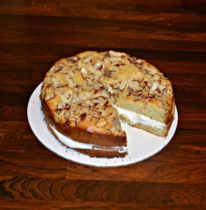 Bee Sting Cake filled with fluffy pastry cream and a crunchy nut topping and rum glaze