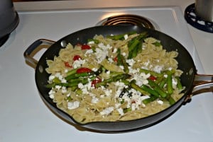 Lemon and Artichoke Pasta with fresh vegetables and cheeses.