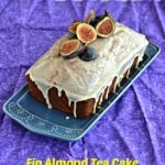 Fig Almond Tea Cake topped with white chocolate Ganache