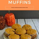 Pin Image: Title, a plate of pumpkin muffins with 2 pumpkins behind the plate.