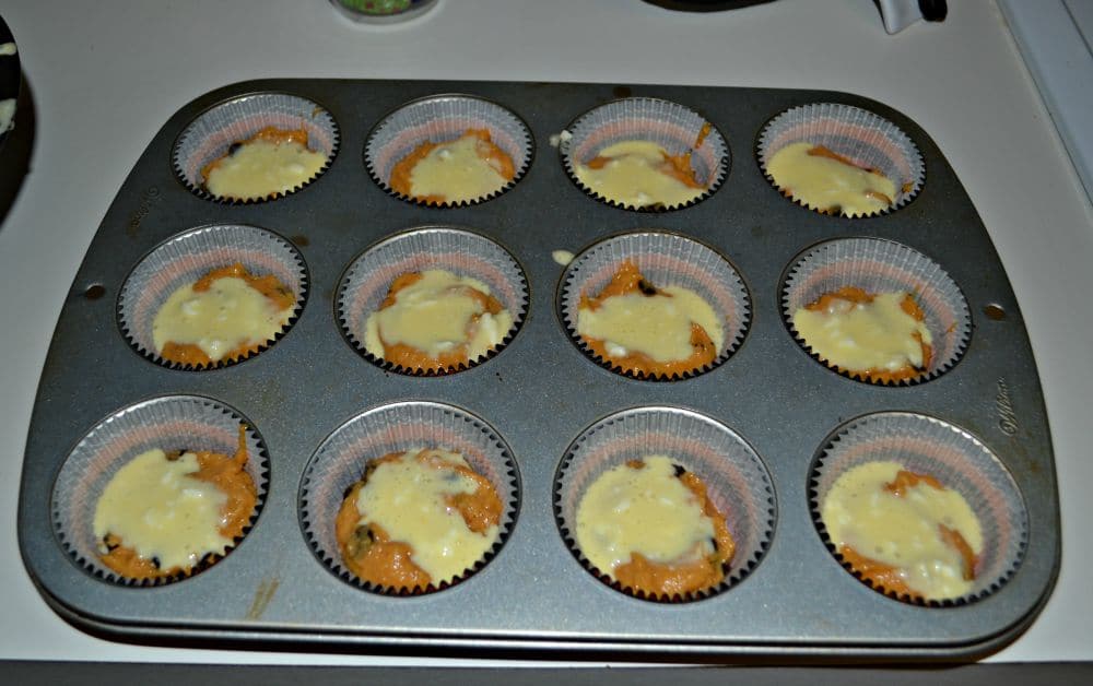 Pumpkin Chocolate Chip Muffins are swirled with cheesecake