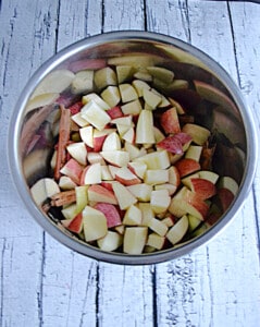 A slow cooker full of apples.