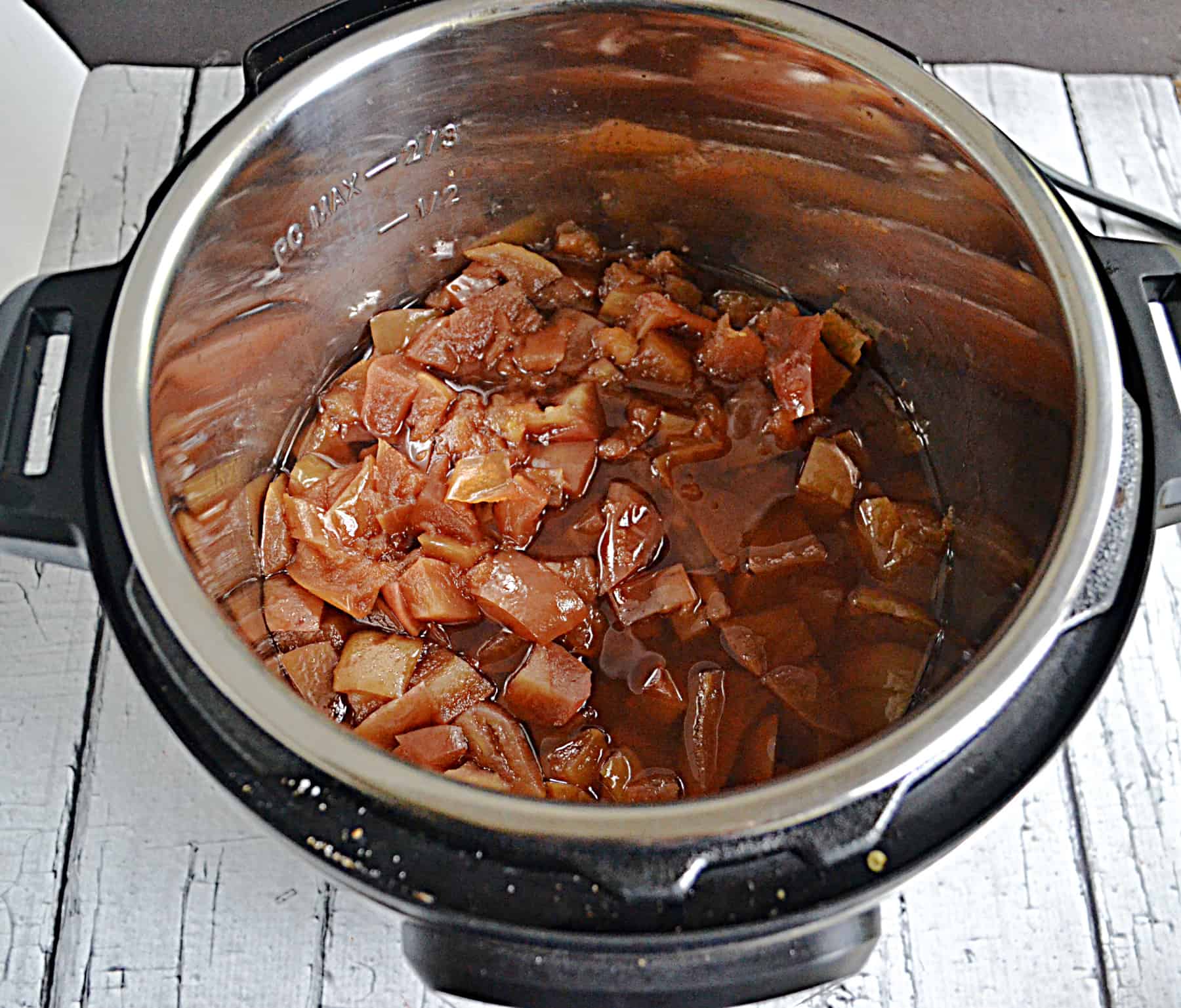 A slow cooker filled with apple butter.