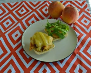 A delicious sweet and spicy sandwich made with Chicken, Peaches, and Arugula